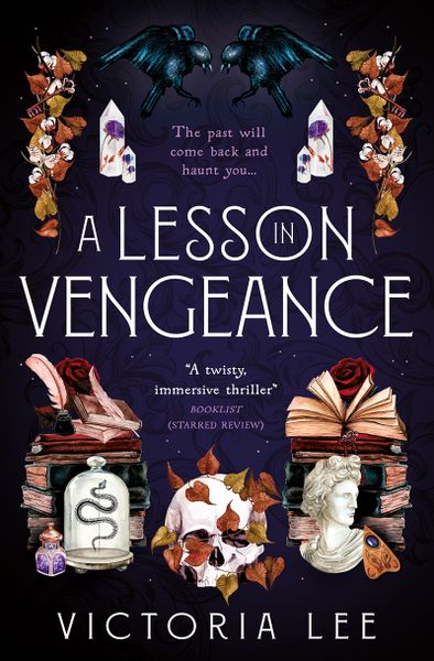A Lesson In Vegeance book cover is dark blue with various objects on. A skull, a statue bust, a Ouija board, scrolls, gems, and quills.